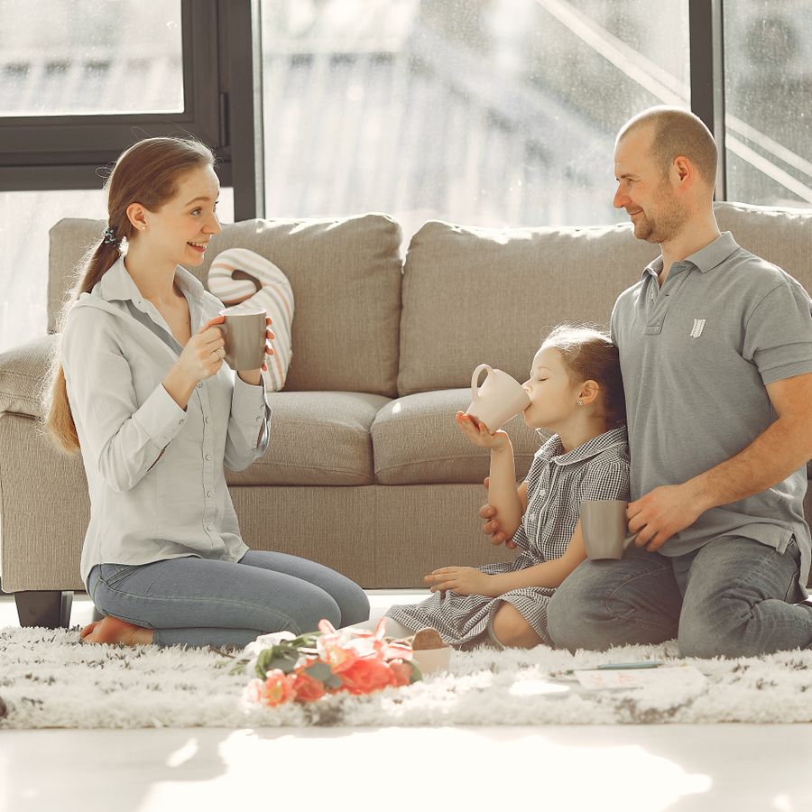 Family relaxing together in a clean, comfortable home
